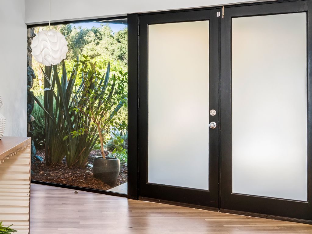 Frosted-glass impact-rated double doors installed in a Southwest Florida home